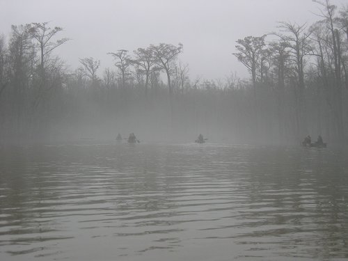 Members of the search team paddle Bayou DeView in winter of 2004.  [Photo by Lauren Morgens.]