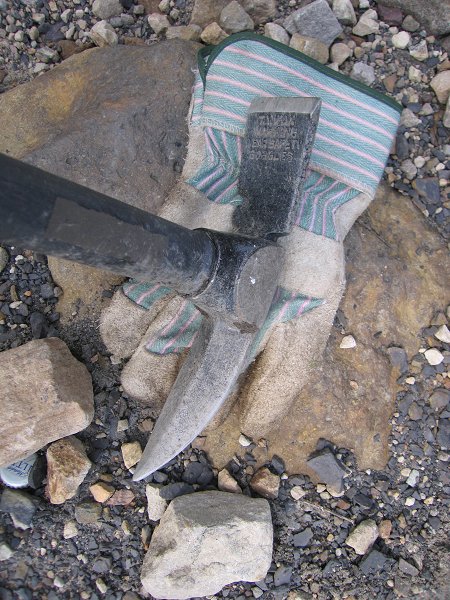 This is my tool of choice: a beveled, pointed blade on one end (used the most) and a straight blade on the other.  The pointed blade sinks well into the shale soils where my infestation occurs.
